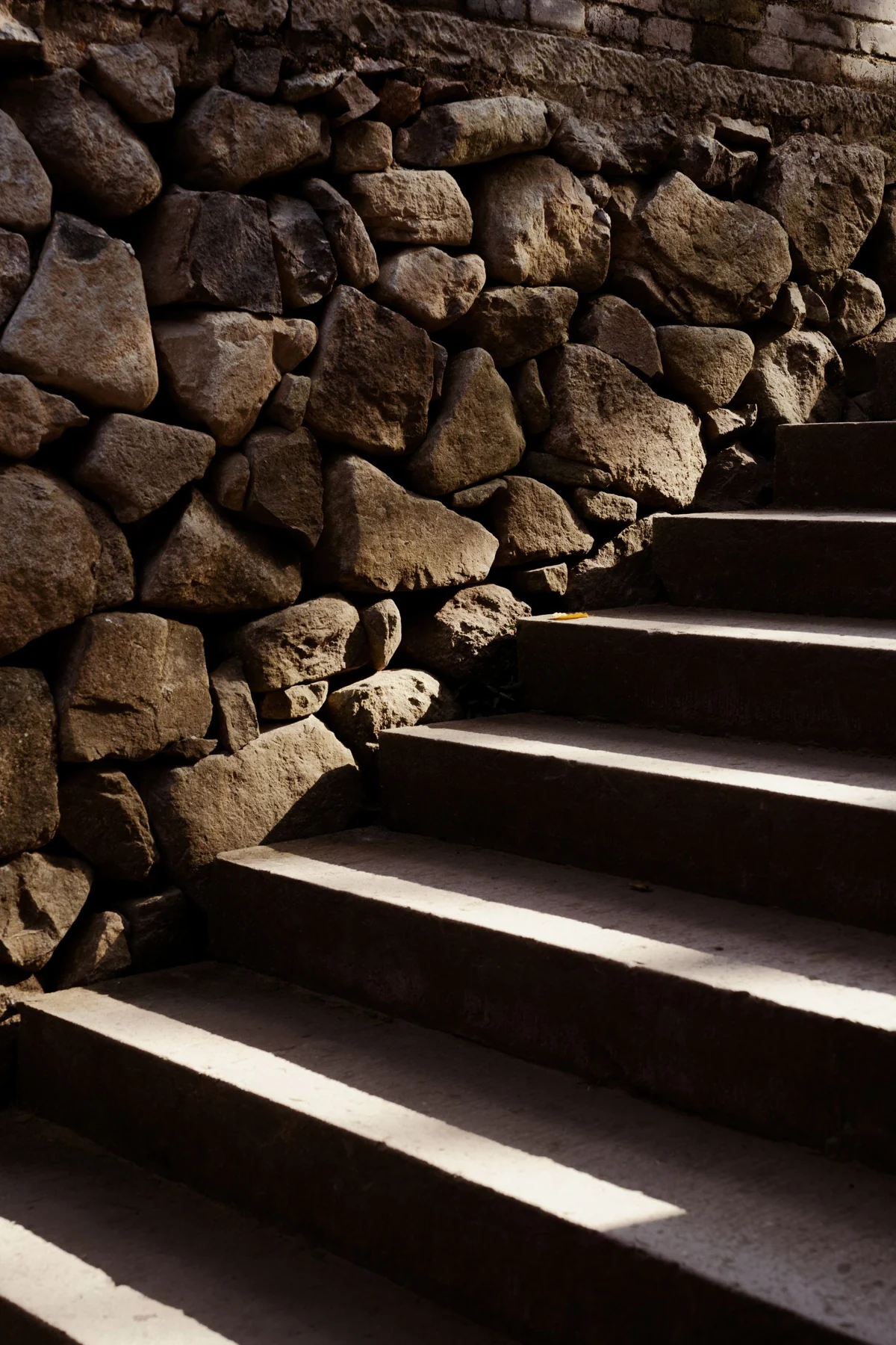 Sunlight drawing lines across stone steps